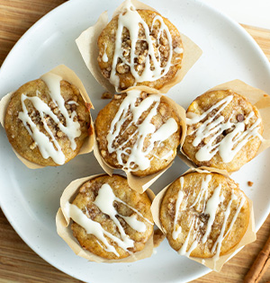 Apple Cinnamon Muffins made with Astro Yogurt sitting on a serving plate.